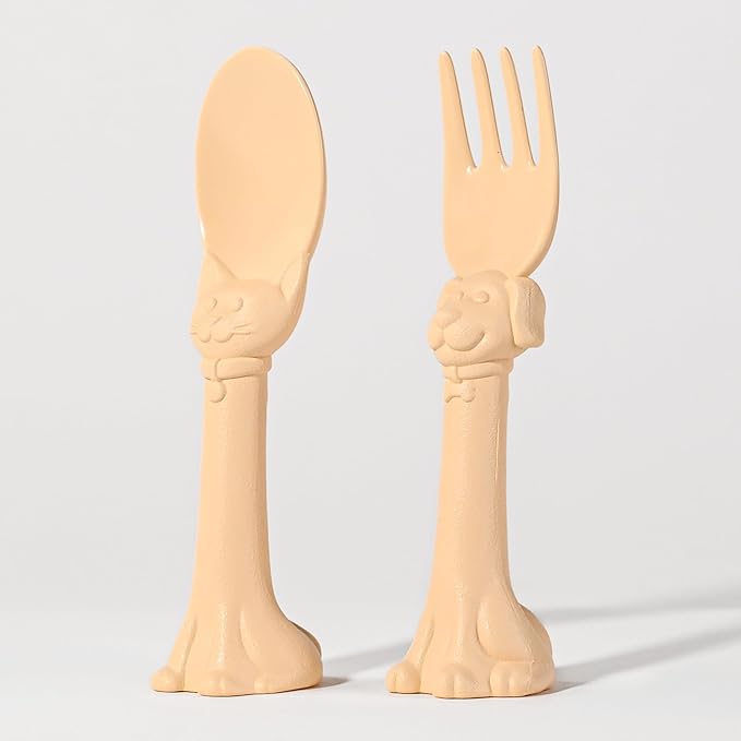 Made in USA Spoon la la Toddler Utensils Set (2 Pack) & Board Book - Spoon & Fork for Kids, Self-Standing 3D Ergonomic Cat & Dog Handles, BPA-free, Dishwasher Safe Baby Silverware (Yellow)