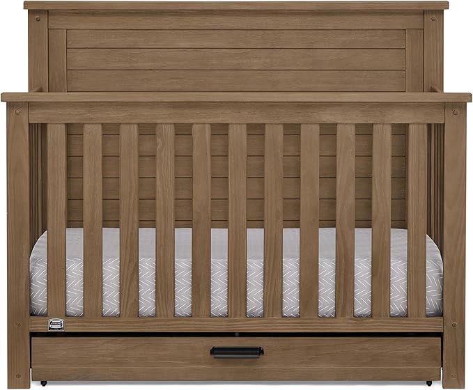 Delta Children Simmons Kids Caden 6-in-1 Convertible Crib with Trundle Drawer, Greenguard Gold Certified, Aged Oak