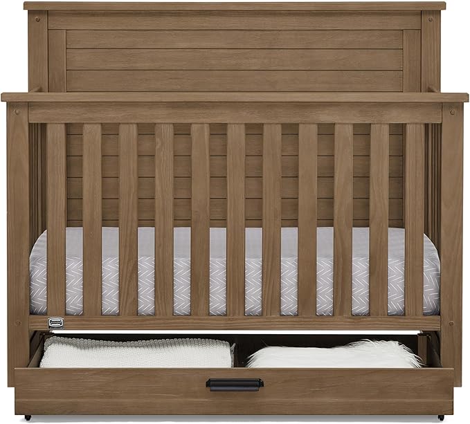 Delta Children Simmons Kids Caden 6-in-1 Convertible Crib with Trundle Drawer, Greenguard Gold Certified, Aged Oak