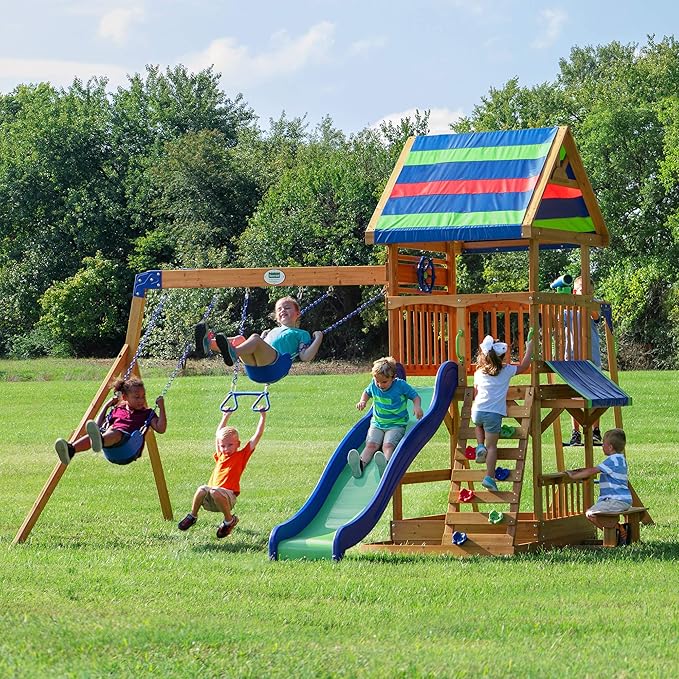 Backyard Discovery Beach Front Cedar Wood Swing Set with Wave Slide, Play Deck, Monkey Bars, Rock Wall Ladder, Shaded Picnic Area, Snack Bar, Belt Swings, Trapeze, Sandbox Area, Outdoor Playset